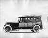 1918 Packard two-toned touring car, left side view, top raised, side curtains in place