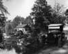 1920 Packard phaeton, parked on country road by stream and mill