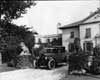 1921-1922 Packard coupe in residential driveway between stone lions