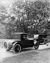 1921-1922 Packard sedan and runabout, pictured passing on country road