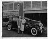 1936 Packard club sedan, parked in front of Packard service department