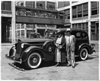 1936 Packard sedan in front of Packard plant, Donderos standing by driver