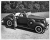 1936 Packard convertible coupe, top folded, female driver and passenger