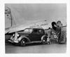 1937 Packard club sedan, parked beside American Airlines plane