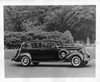 1937 Packard touring sedan in park-like setting