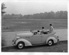 1937 Packard convertible sedan with female driver