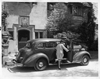 1937 Packard touring sedan at Grosse Pointe, Mich. home, female stepping into car