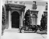 1937 Packard formal sedan, parked in driveway in front of house with chauffeur