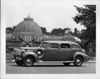 1938 Packard touring sedan parked in front of Belle Isle conservatory