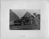 1939 Packard touring sedan in front of pyramids with two men and camels