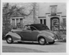 1939 Packard convertible coupe, top raised, parked in driveway of home