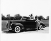 1941 Packard convertible, female sitting in back, female opening driver