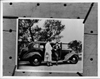1936 Packard touring sedan, Onslow Stevens assisting Evalyn Knapp