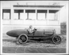 Packard 299 race car, left side view, two men inside