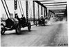 Chalmers cars crossing bridge in 1909 Glidden Tour automobile parade, Detroit, Mich.