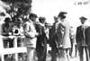 Mr. Savage and Mr. Birmingham in a group of men at race track in Minnesota, at the 1909 Glidden Tour