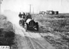 Gus Buse in Thomas car on rural road near Missouri Valley, Iowa at 1909 Glidden Tour