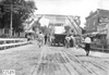 Glidden tourist vehicle stopped under banner at Crescent, Iowa at 1909 Glidden Tour