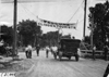 Glidden tourist car passes under welcome banner at Council Bluffs, Iowa at 1909 Glidden Tour