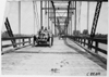 John C. Moore driving the Lexington car #114 over Loup River bridge, at the 1909 Glidden Tour