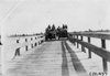 Thomas car and the Studebaker car crossing bridge, at the 1909 Glidden Tour