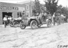 Duesenberg in Mason stopped in front of an automobile store at Ft. Morgan, Colo., at 1909 Glidden Tour