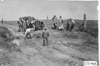 Thomas car stopped before large ditch, men standing around, near Aurora, Colo., at 1909 Glidden Tour