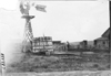 Windmill with farm family in Nebraska, at the 1909 Glidden Tour