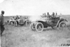 Participants on the prairie waiting for bridge repair, at the 1909 Glidden Tour