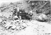 Rapid motor truck stuck on rock covered mountain road in Colo., at 1909 Glidden Tour