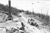 Glidden tourists pushing Rapid motor truck on steep mountain road in Colo., at 1909 Glidden Tour