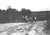 Couple looks on as Rapid motor truck goes by on rural road near Colorado Springs, Colo., at 1909 Glidden Tour
