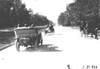 Glidden tourists driving down tree lined street near Colorado Springs, Colo., at 1909 Glidden Tour