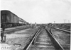 Glidden tourists stopped at railroad yard at the 1909 Glidden Tour
