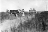 Premier car passing Moline car on rural road in Kansas, at 1909 Glidden Tour