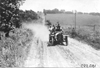 George Weidely in Premier car on rural road near Manhattan, Kan., at 1909 Glidden Tour