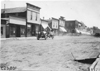 Glidden participants in rural town, at the 1909 Glidden Tour