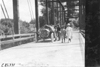 Car #83 on Canton bridge with girls, at the 1909 Glidden Tour