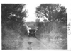 E.M.F. car stopped by water over rural road, on pathfinder tour for 1909 Glidden Tour