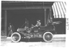 E.M.F. car parked in front of a building, on pathfinder tour for 1909 Glidden Tour