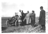 Dai Lewis talking with men near E.M.F. car, on pathfinder tour for 1909 Glidden Tour
