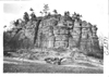 E.M.F. car passing large rock formation, on pathfinder tour for 1909 Glidden Tour
