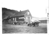 E.M.F. car parked in front of saloon, on pathfinder tour for 1909 Glidden Tour