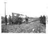 E.M.F. car being pried out of mud, on pathfinder tour for 1909 Glidden Tour