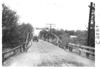 E.M.F. car crossing bridge with sign, on pathfinder tour for 1909 Glidden Tour
