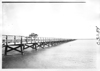 E.M.F. car crossing wooden bridge, on pathfinder tour for 1909 Glidden Tour