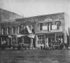 Businesses horses and carts, 100 Block South Washington, Lansing