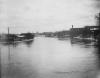 Flooded river with factories, Lansing, 1904