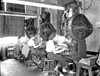 Women working at the stamping machines at Daisy Manufacturing