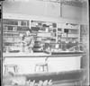 Woman working behind the Counter in a store